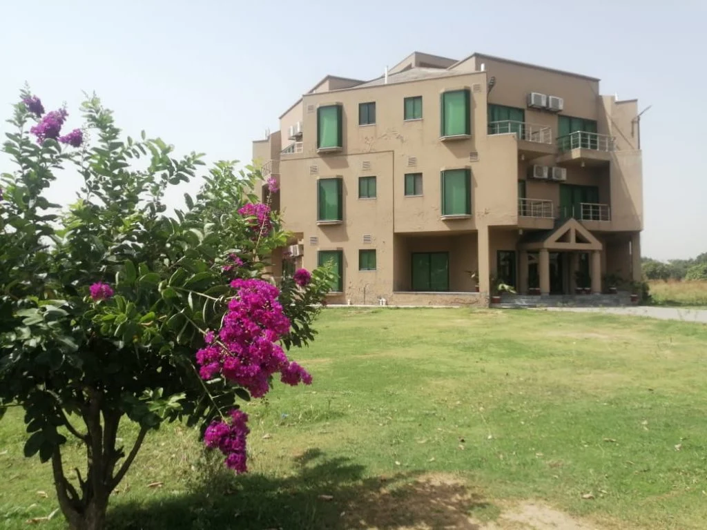 CEMB Guest House exterior with landscaped garden
