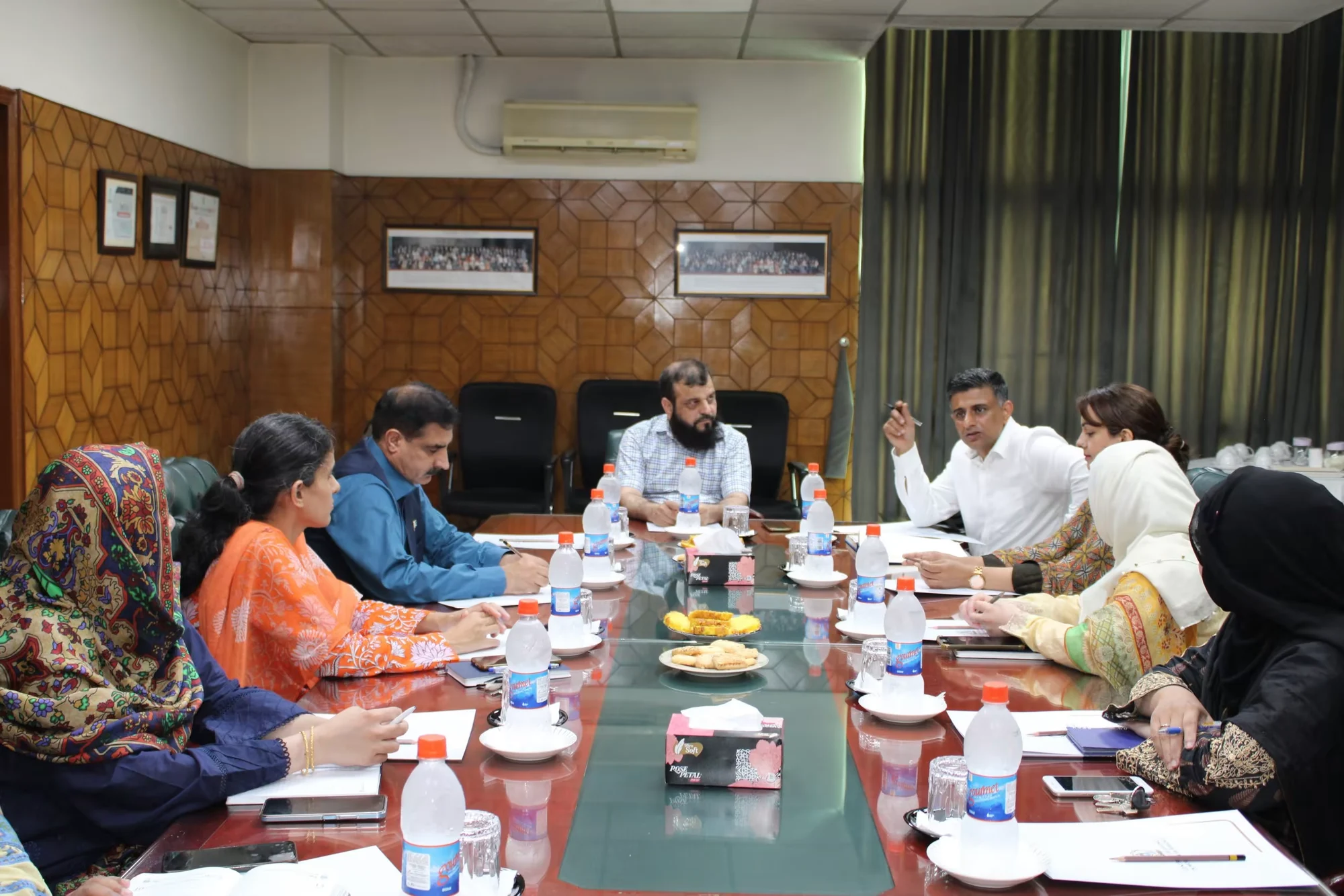CEMB committee meeting with documents under review
