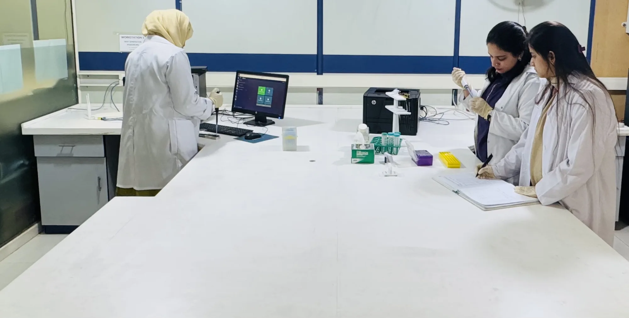 CEMB research team working together in a laboratory