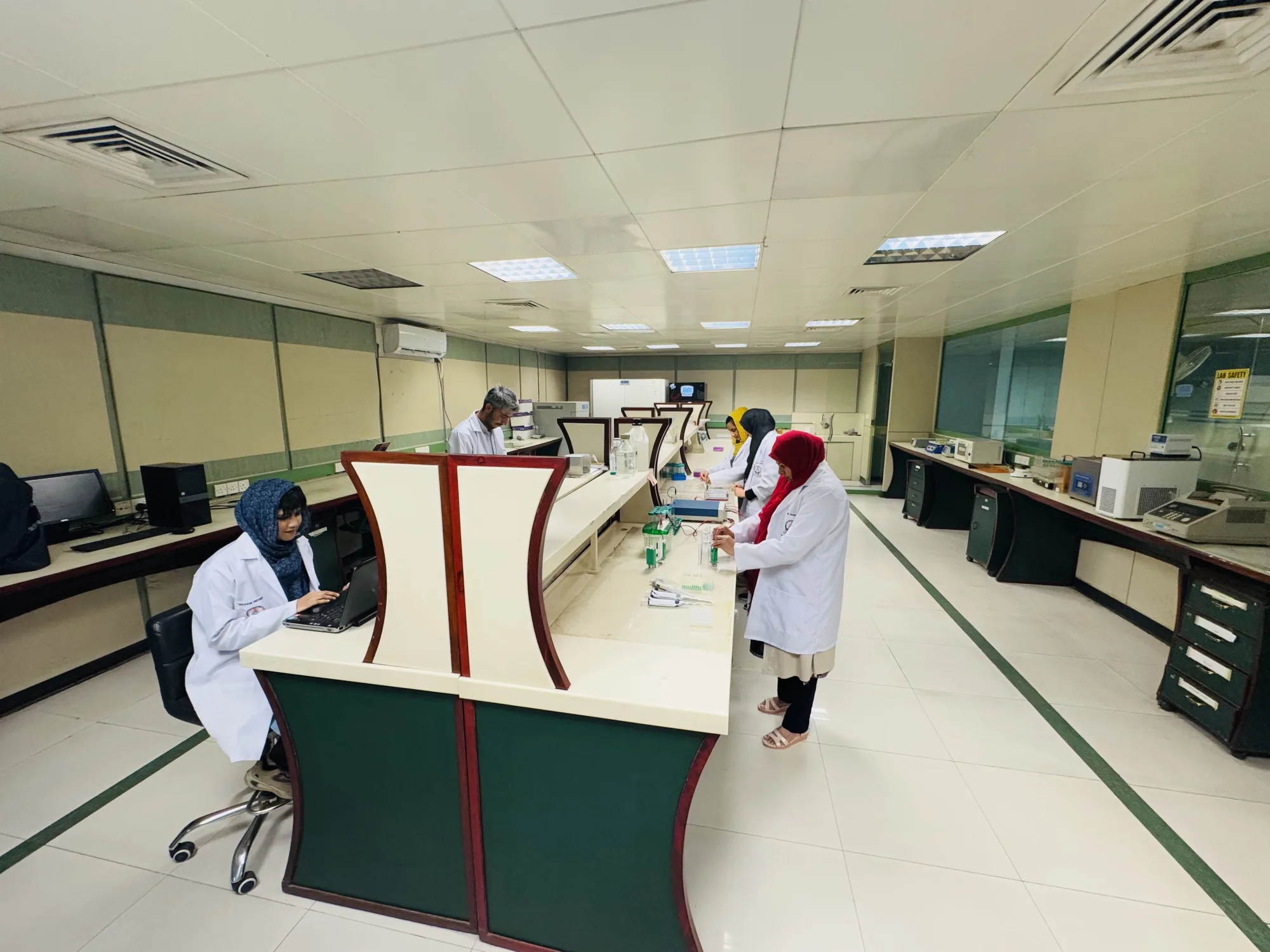 CEMB researchers working together in the central laboratory